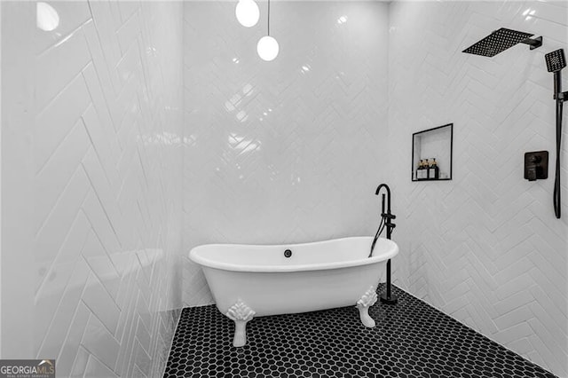 bathroom featuring a tile shower, tile patterned floors, a soaking tub, and tile walls