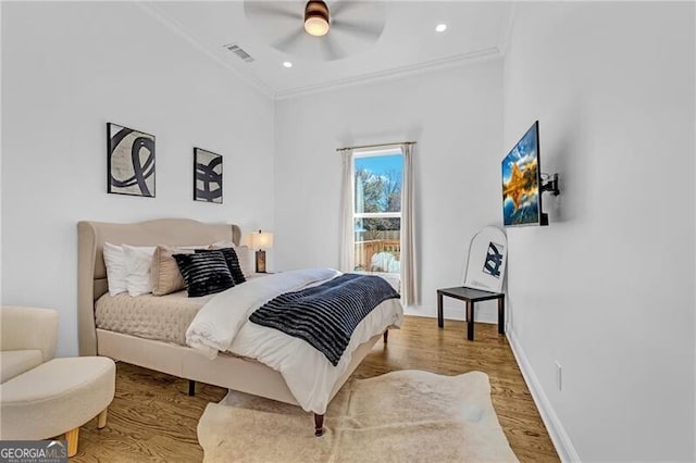 bedroom with crown molding, visible vents, recessed lighting, wood finished floors, and baseboards