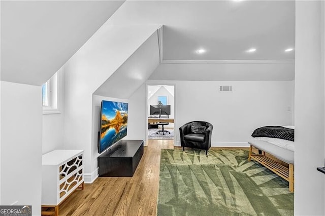interior space featuring visible vents, baseboards, recessed lighting, and wood finished floors
