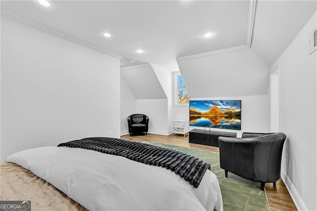 bedroom with ornamental molding, vaulted ceiling, recessed lighting, wood finished floors, and baseboards
