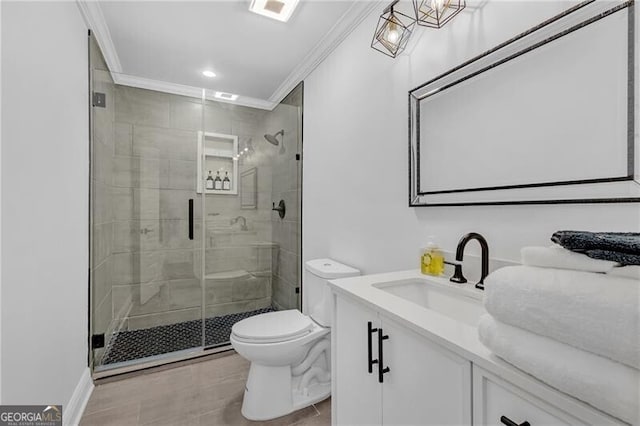 full bathroom with toilet, vanity, ornamental molding, and a stall shower