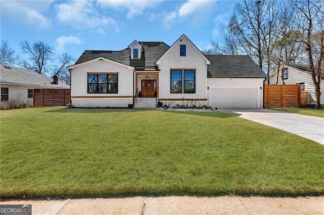 view of front of house with driveway, a front lawn, brick siding, a garage, and fence
