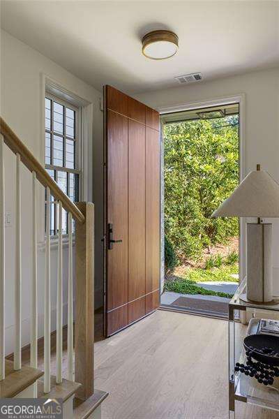 entryway with visible vents and wood finished floors