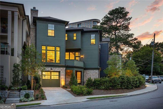 modern home featuring an attached garage and concrete driveway