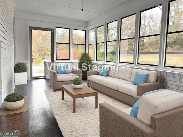 sunroom with a wealth of natural light and wood finished floors