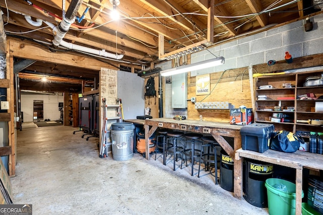unfinished basement with a workshop area