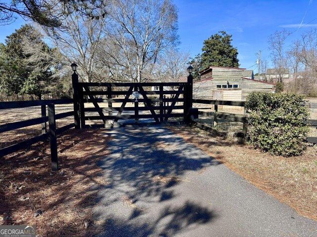 view of gate with fence