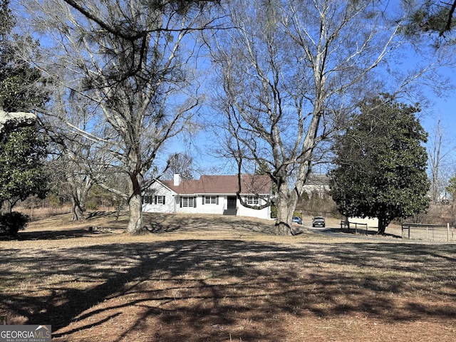 view of front of property with a chimney