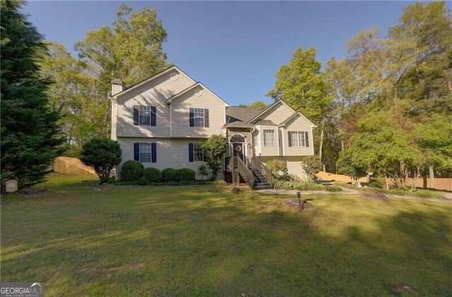 209 Red Fern Ct, Canton, GA 30114 - view of front of home featuring a chimney and a front yard