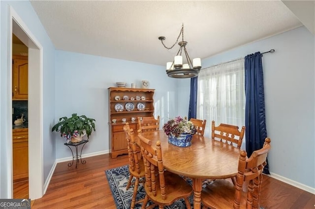 209 Red Fern Ct, Canton, GA 30114 - dining space featuring a chandelier, light wood-type flooring, and baseboards