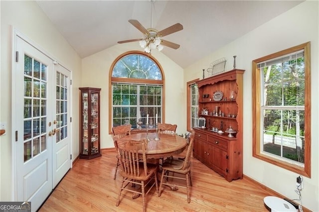 209 Red Fern Ct, Canton, GA 30114 - dining space featuring light wood finished floors, french doors, vaulted ceiling, healthy amount of natural light, and ceiling fan