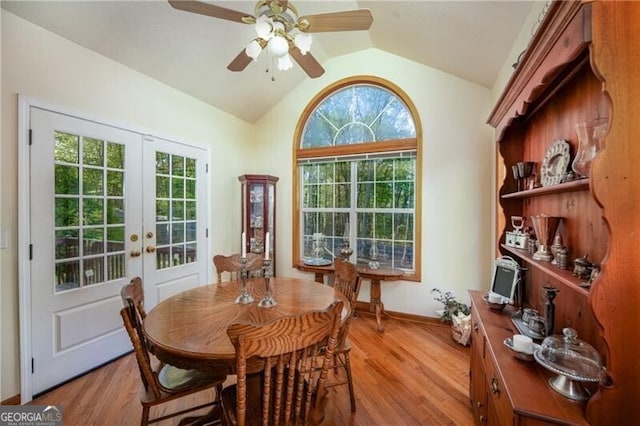 209 Red Fern Ct, Canton, GA 30114 - dining room with french doors, vaulted ceiling, light wood finished floors, ceiling fan, and baseboards