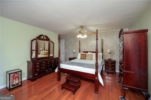 209 Red Fern Ct, Canton, GA 30114 - bedroom featuring wood finished floors, ceiling fan, baseboards, and a textured ceiling