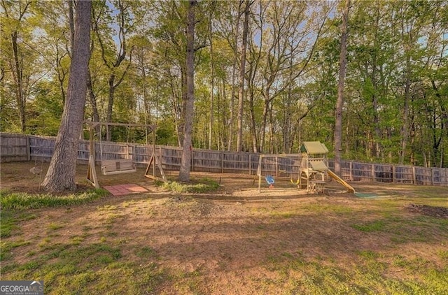 209 Red Fern Ct, Canton, GA 30114 - fenced backyard with a playground