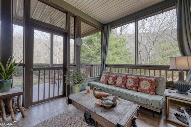 sunroom / solarium with outdoor lounge area and healthy amount of natural light