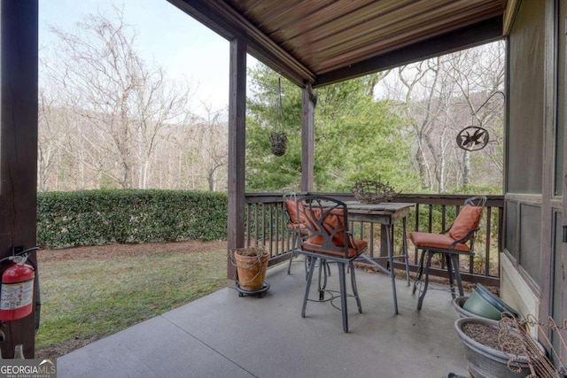 view of patio / terrace featuring a forest view