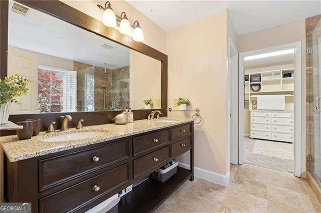 310 Kingspring Ct, Roswell, GA 30076 - full bathroom with visible vents, a sink, and a stall shower