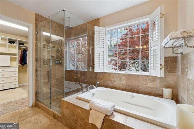 310 Kingspring Ct, Roswell, GA 30076 - bathroom featuring a shower stall, a walk in closet, and a bath