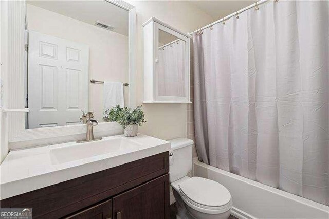 310 Kingspring Ct, Roswell, GA 30076 - full bathroom featuring toilet, shower / bath combo, vanity, and visible vents
