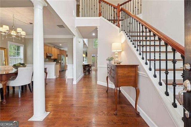 310 Kingspring Ct, Roswell, GA 30076 - foyer entrance with an inviting chandelier, a high ceiling, wood finished floors, and stairs