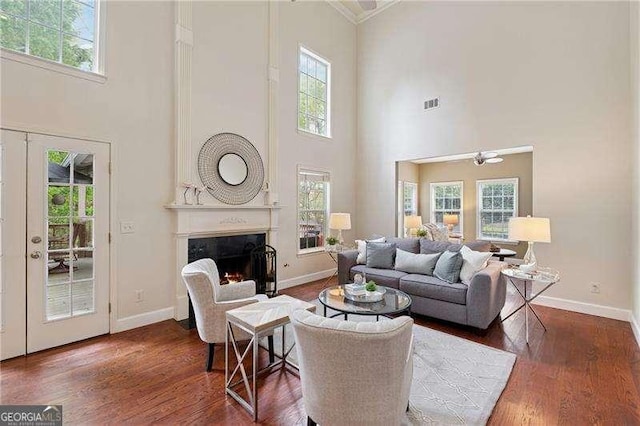 310 Kingspring Ct, Roswell, GA 30076 - living room featuring visible vents, baseboards, wood finished floors, and a premium fireplace