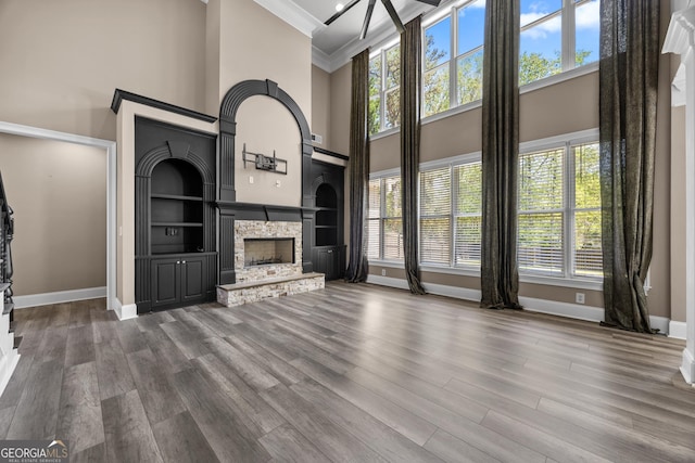 774 Mary Ann Dr NE, Marietta, GA 30068 - unfurnished living room with dark wood-type flooring, a wealth of natural light, and a fireplace