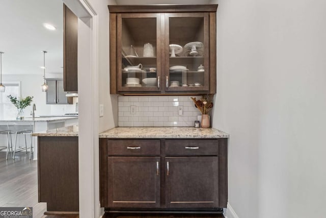 214 Leland Way, Woodstock, GA 30188 - bar with wood finished floors, decorative backsplash, and recessed lighting