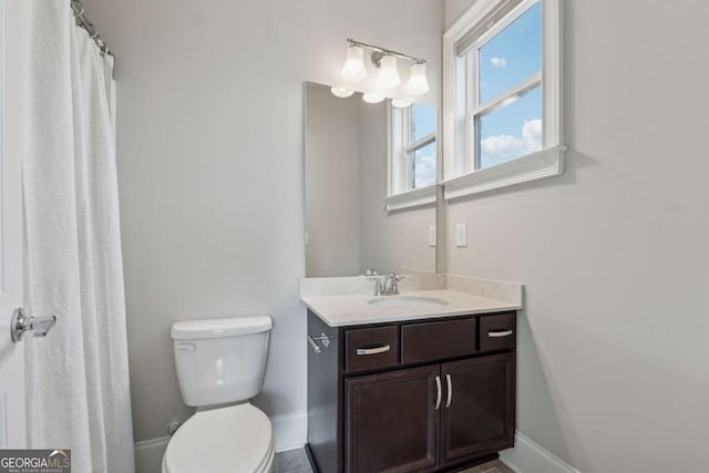 214 Leland Way, Woodstock, GA 30188 - full bath featuring toilet, vanity, and baseboards