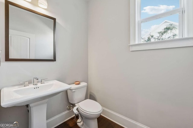 214 Leland Way, Woodstock, GA 30188 - half bath with baseboards, toilet, and wood finished floors