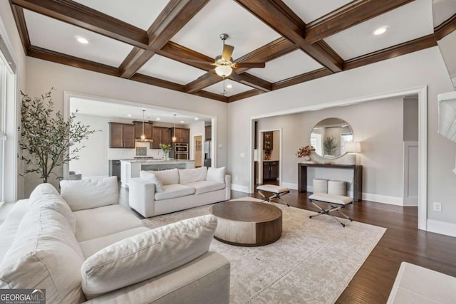 214 Leland Way, Woodstock, GA 30188 - living room featuring coffered ceiling, baseboards, beam ceiling, and ceiling fan
