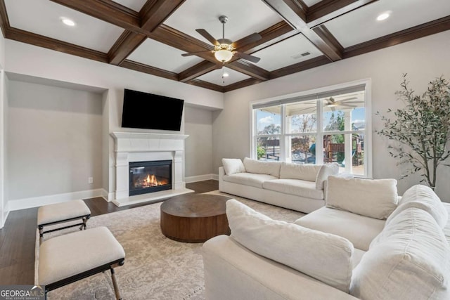 214 Leland Way, Woodstock, GA 30188 - living area featuring a glass covered fireplace, baseboards, a ceiling fan, beam ceiling, and wood finished floors