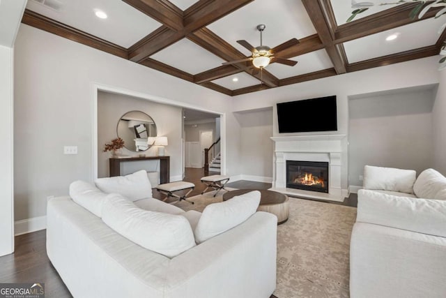 214 Leland Way, Woodstock, GA 30188 - living area with a glass covered fireplace, stairs, a ceiling fan, and beam ceiling