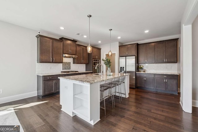 214 Leland Way, Woodstock, GA 30188 - kitchen featuring dark brown cabinetry, baseboards, open shelves, decorative backsplash, and stainless steel appliances