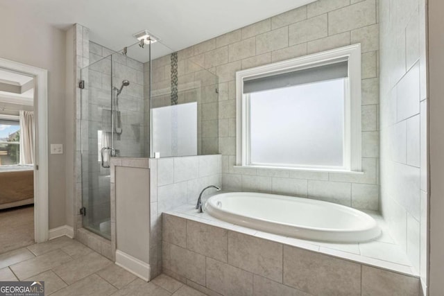 214 Leland Way, Woodstock, GA 30188 - bathroom with a bath, a stall shower, and tile patterned floors
