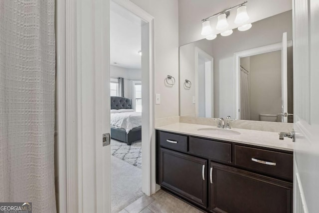 214 Leland Way, Woodstock, GA 30188 - full bath with toilet, tile patterned floors, vanity, and ensuite bathroom
