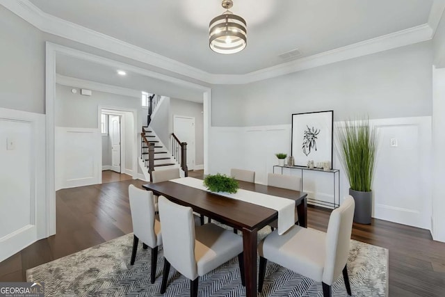 214 Leland Way, Woodstock, GA 30188 - dining room featuring dark wood-style flooring, ornamental molding, stairway, and wainscoting