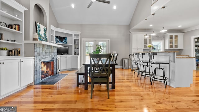 745 Pleasant Valley Rd SE, Silver Creek, GA 30173 - dining space featuring a ceiling fan, light wood-type flooring, a tiled fireplace, built in features, and recessed lighting