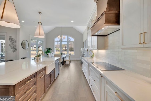 123 Candler Loop, Acworth, GA 30101 - kitchen featuring custom exhaust hood, black electric stovetop, light wood finished floors, vaulted ceiling, and dishwasher