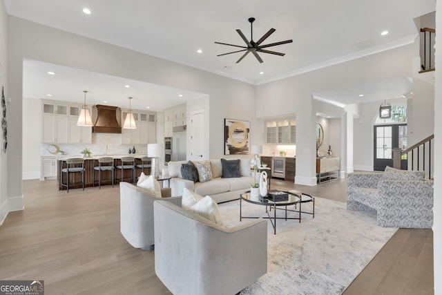 123 Candler Loop, Acworth, GA 30101 - living room with a ceiling fan, light wood-style flooring, recessed lighting, beverage cooler, and crown molding