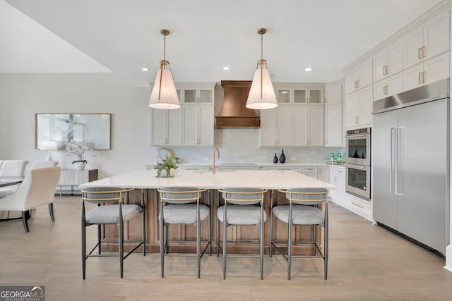 123 Candler Loop, Acworth, GA 30101 - kitchen featuring appliances with stainless steel finishes, premium range hood, light countertops, white cabinets, and recessed lighting