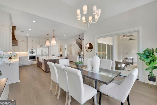 123 Candler Loop, Acworth, GA 30101 - dining area featuring stairs, light wood-style floors, a chandelier, recessed lighting, and ceiling fan