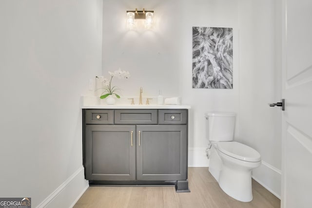 123 Candler Loop, Acworth, GA 30101 - half bath featuring vanity and wood finished floors