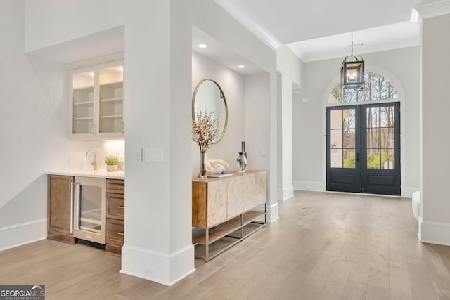 123 Candler Loop, Acworth, GA 30101 - foyer with wine cooler, french doors, bar with sink, light wood-style floors, and recessed lighting