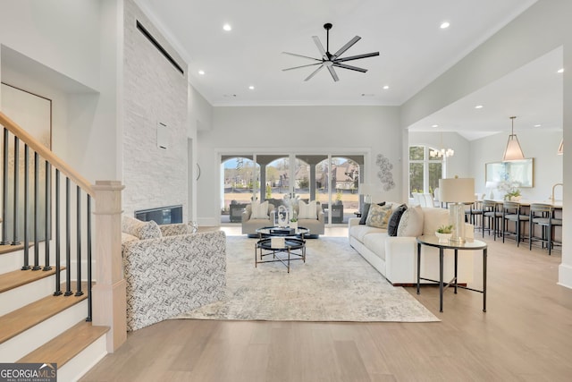 123 Candler Loop, Acworth, GA 30101 - living area featuring a ceiling fan, wood finished floors, stairs, ornamental molding, and recessed lighting