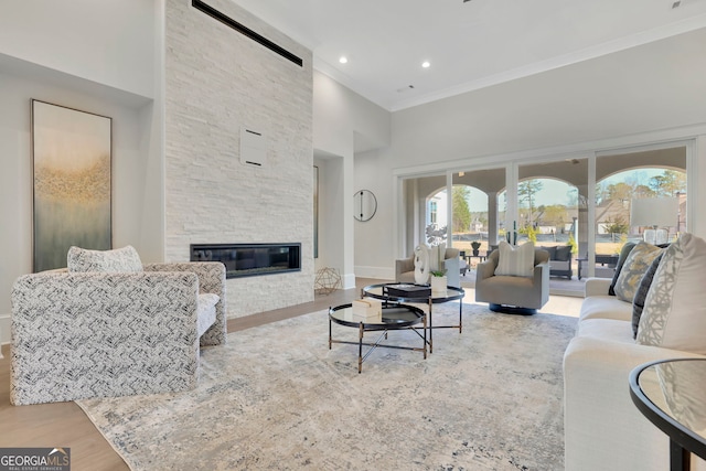 123 Candler Loop, Acworth, GA 30101 - living room with ornamental molding, wood finished floors, a fireplace, a high ceiling, and recessed lighting