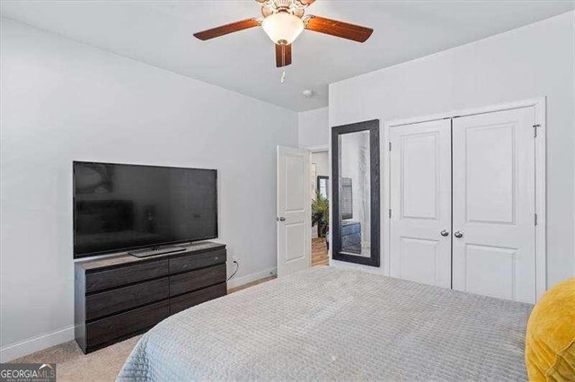 75 Glen Abbey Cir, Fairburn, GA 30213 - bedroom featuring a closet, baseboards, ceiling fan, and carpet