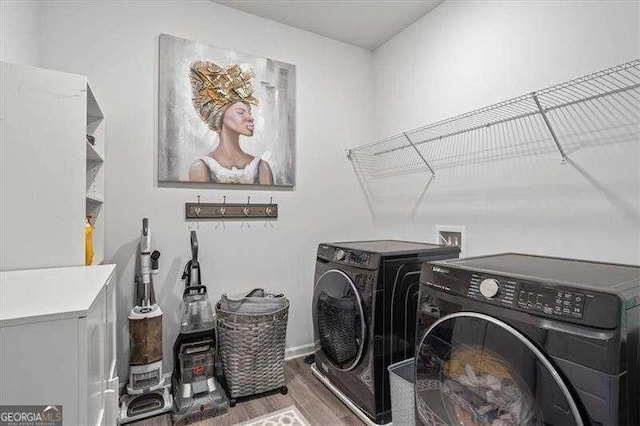 75 Glen Abbey Cir, Fairburn, GA 30213 - washroom featuring wood finished floors, separate washer and dryer, and laundry area