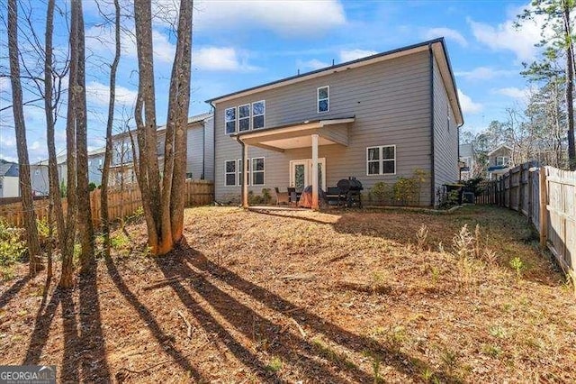 75 Glen Abbey Cir, Fairburn, GA 30213 - back of house with a fenced backyard