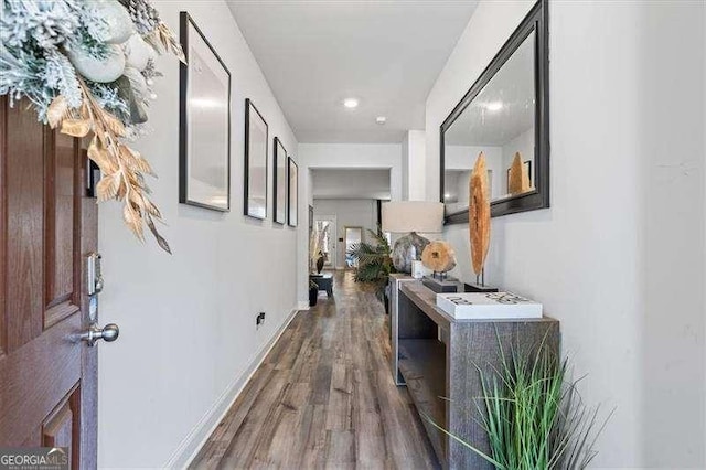 75 Glen Abbey Cir, Fairburn, GA 30213 - hall with baseboards and wood finished floors