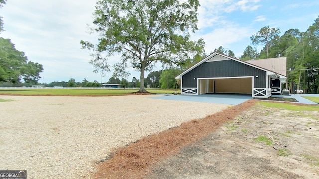 garage with gravel driveway